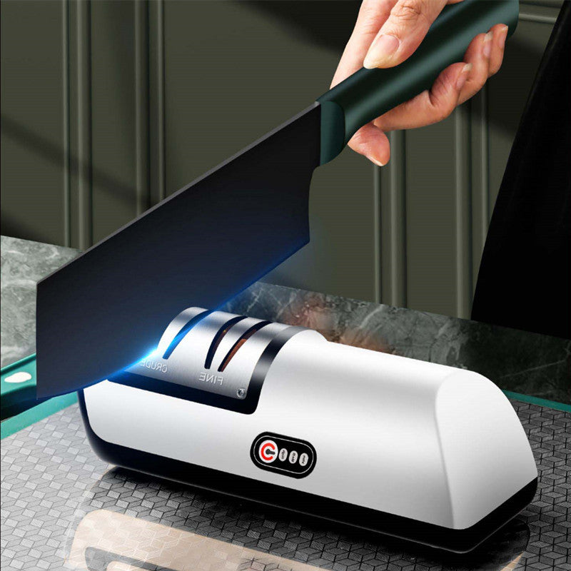 USB rechargeable electric knife sharpener with white body and black base, blue sharpening glow