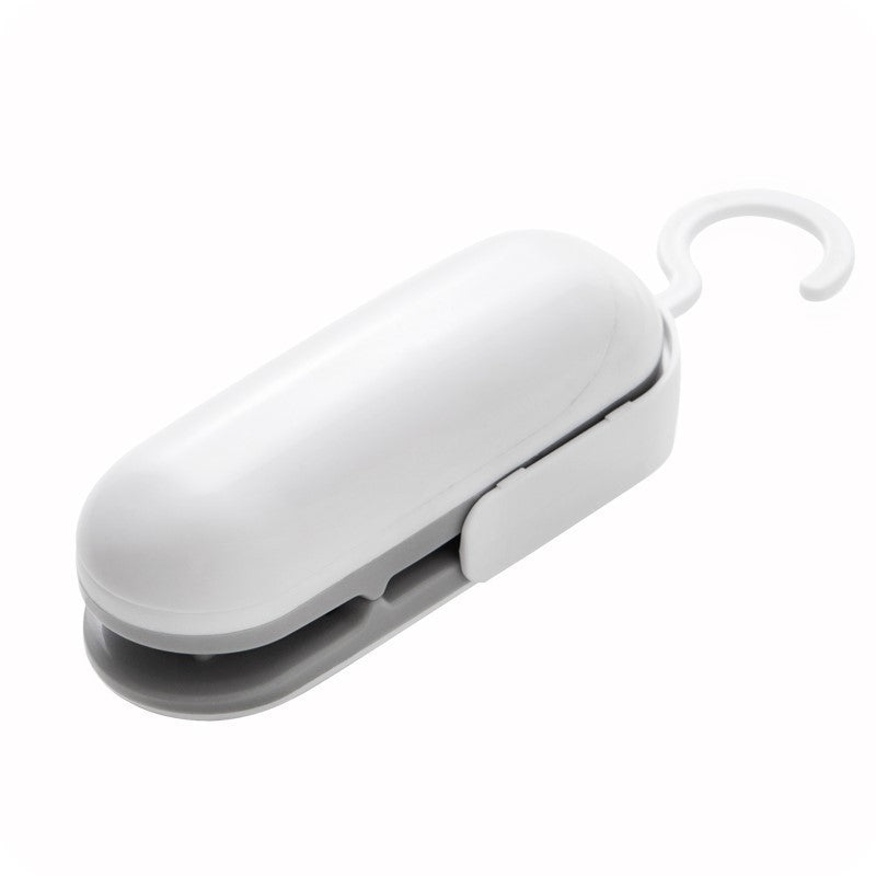 Mini portable heat sealer tool in white with side seal bar and hanging hook