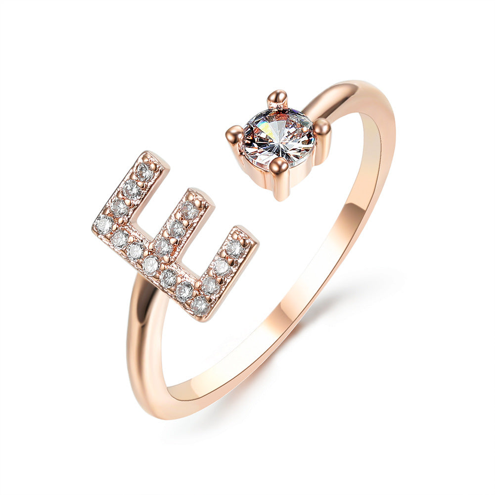 Rose gold initial H ring with round crystal center and pave H detail