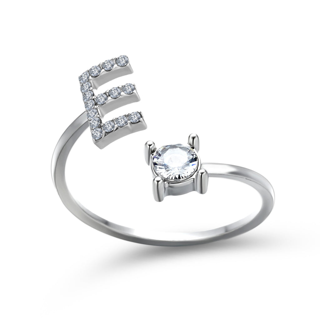 Silver adjustable initial letter ring with pave letter detail and oval center stone.