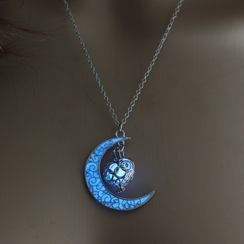 Glowing blue moon pendant necklace with cat lantern charm on silver chain