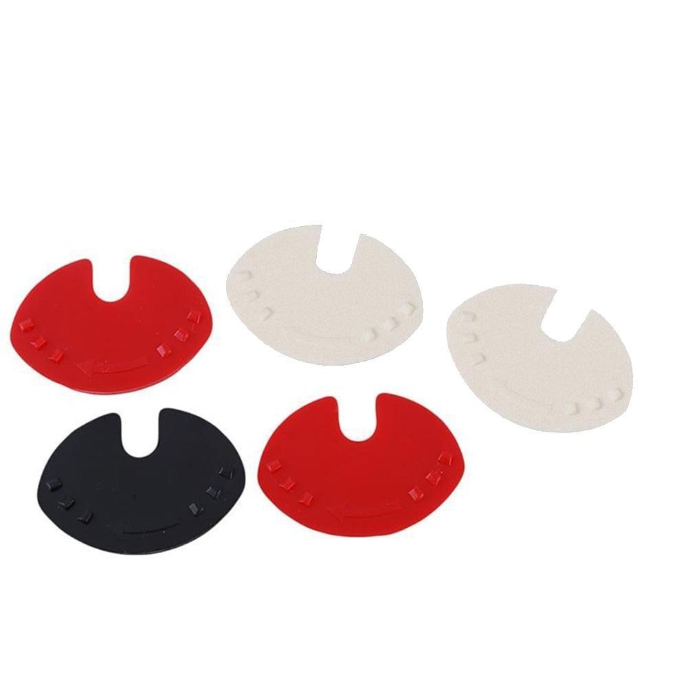 Can sealer tabs, red black and white animal-shaped pieces for can tops