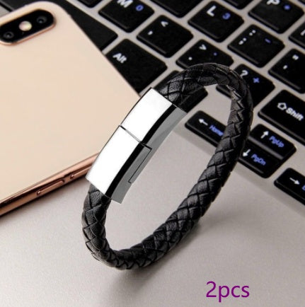 Black braided charging cable bracelet with silver metal clasp and USB connector