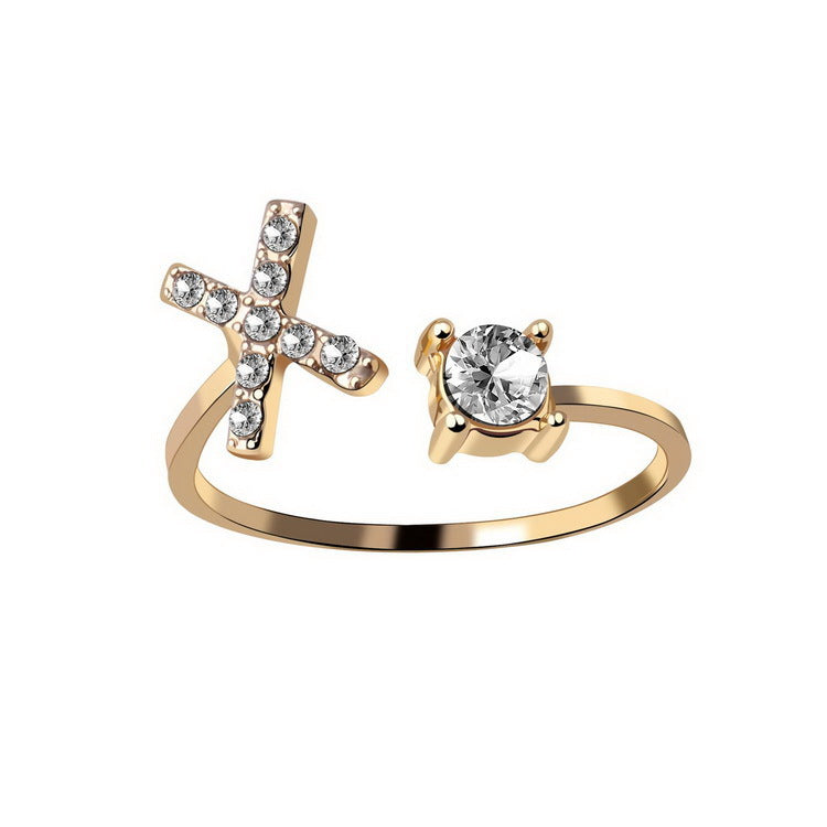Gold adjustable initial letter ring with round crystal and crystal-set cross-like letter