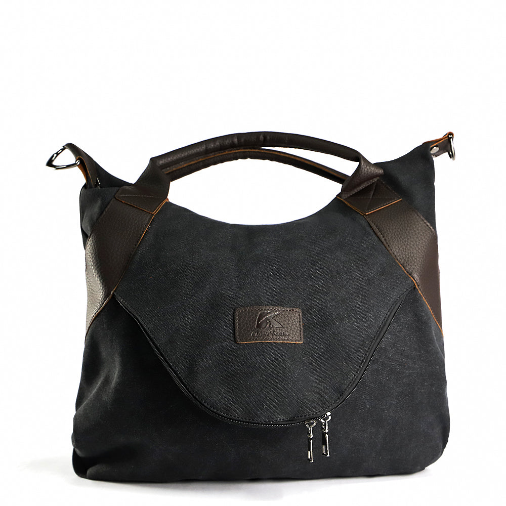 Black canvas shoulder bag with brown trim, top handles, and hanging zipper details