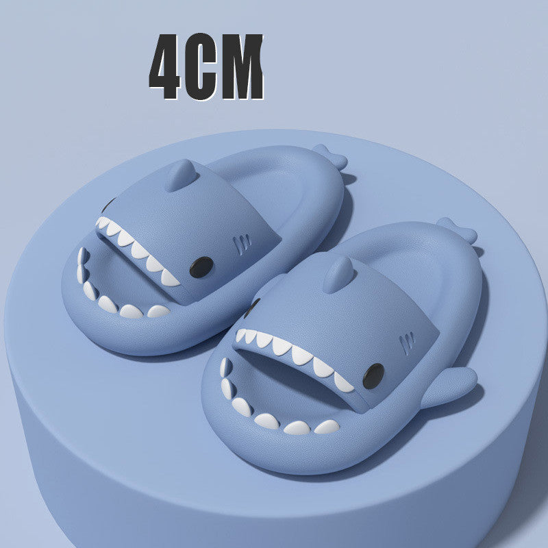 Cartoon shark slippers, blue slide-on sandals with white teeth and fin accents