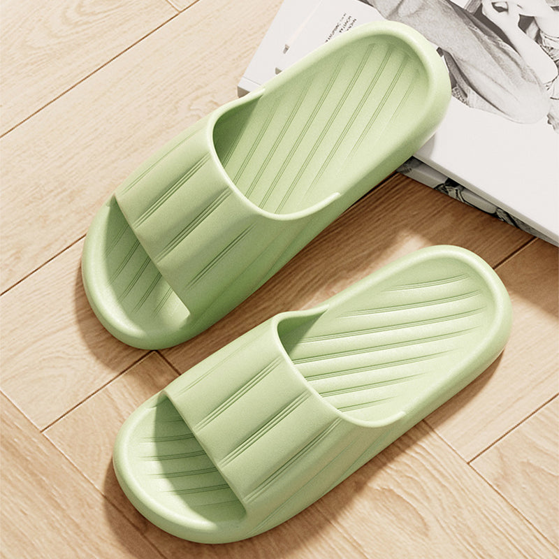 Light green slide slippers with striped strap and cushioned thick sole