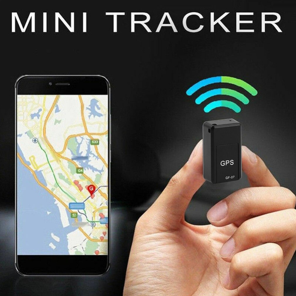 Magnetic mini GPS car tracker with GPS label, held in a hand