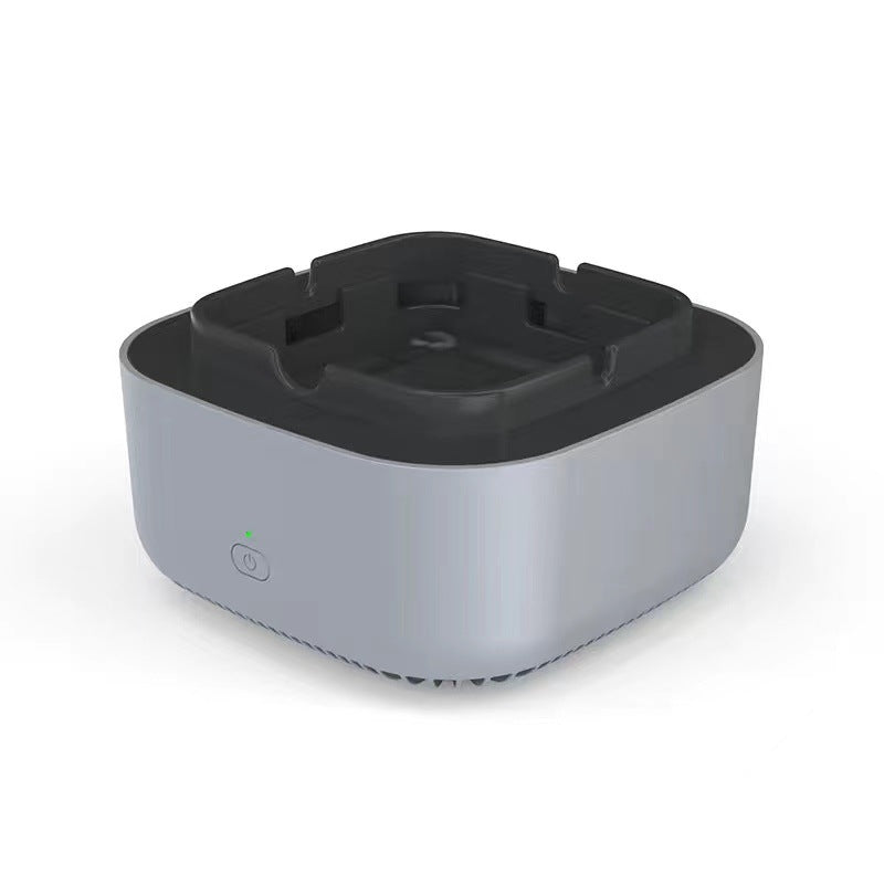 White electronic ashtray air purifier with black inner bowl and circular power icon