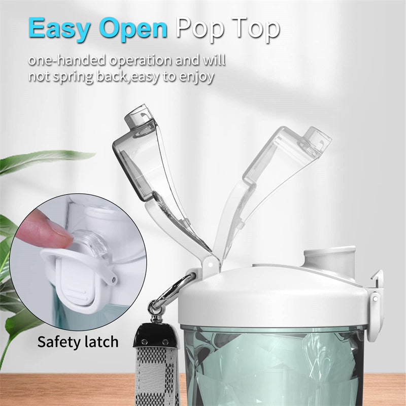 Portable blender with pop-top lid and safety latch on clear blending bottle