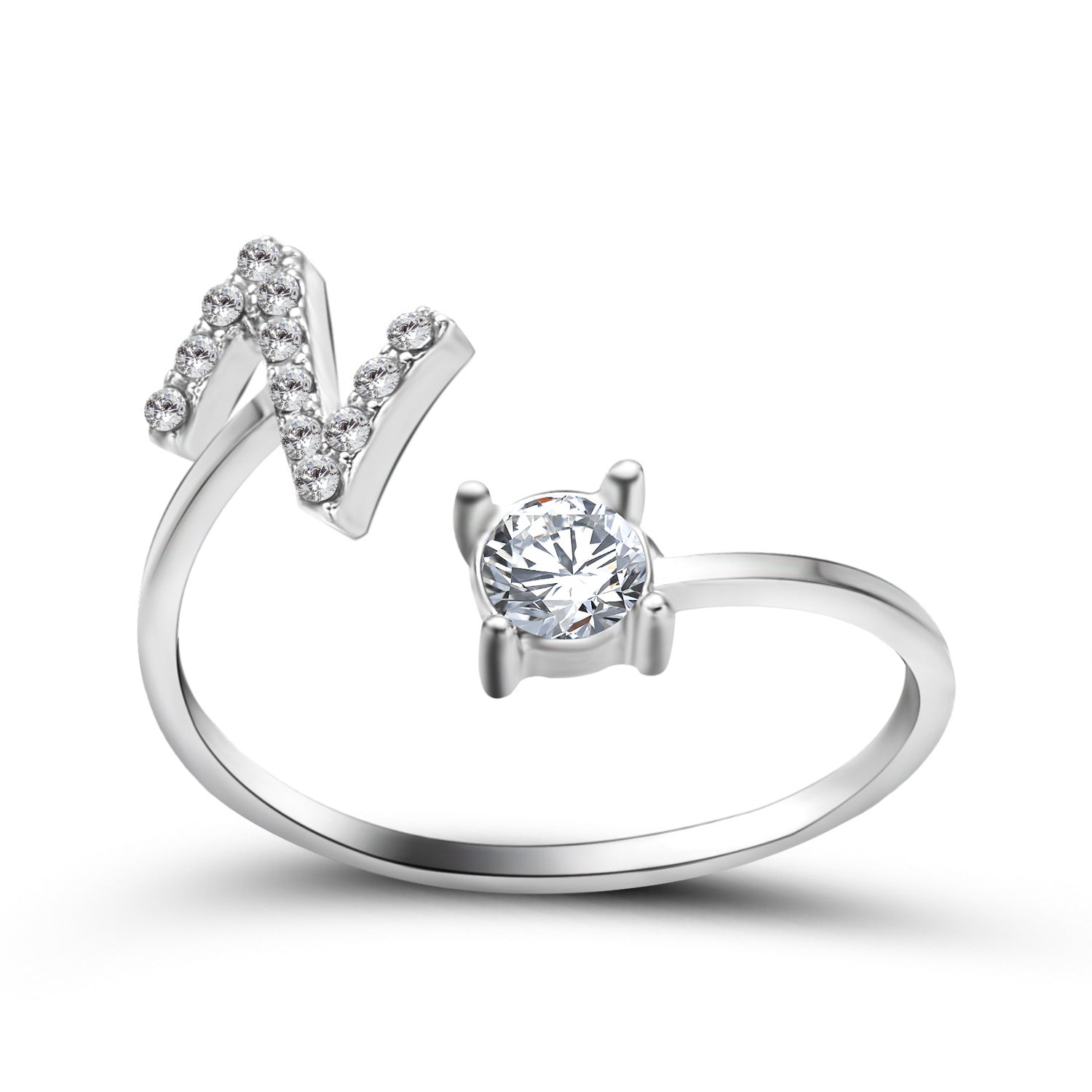 Silver adjustable initial letter ring with pave letter detail and oval center stone.