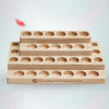 Essential oil display stand with stacked round slots, light wood, CP TG Certified mark