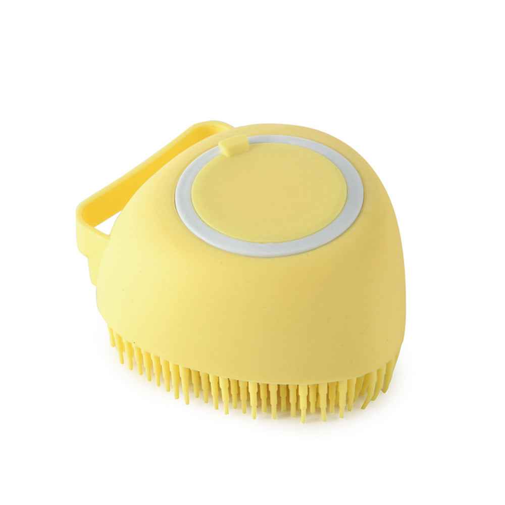 Yellow silicone pet grooming brush with oval massage pad and dense bristles