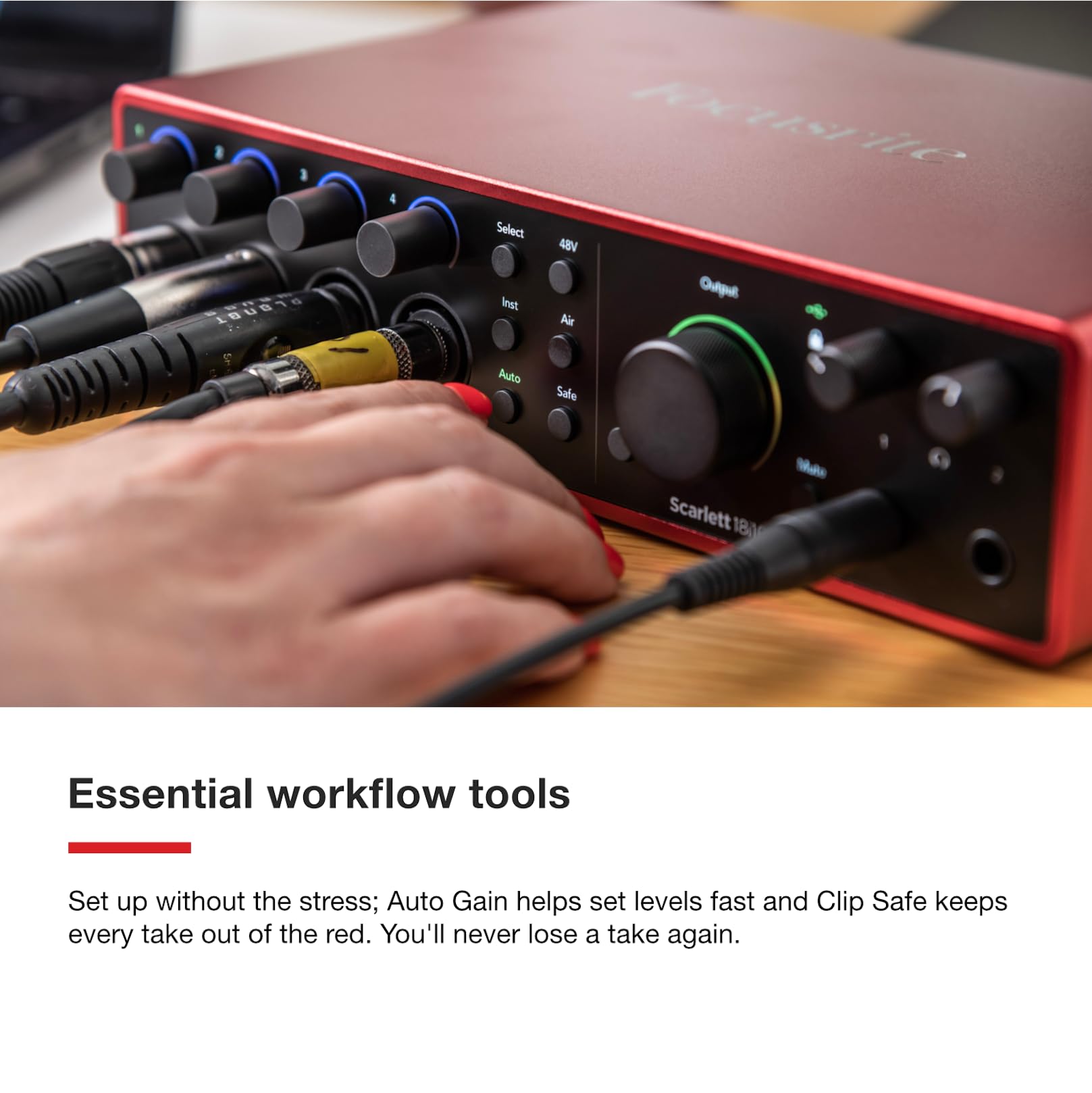 Red Focusrite Scarlett 18i16 USB audio interface with hand adjusting a front knob