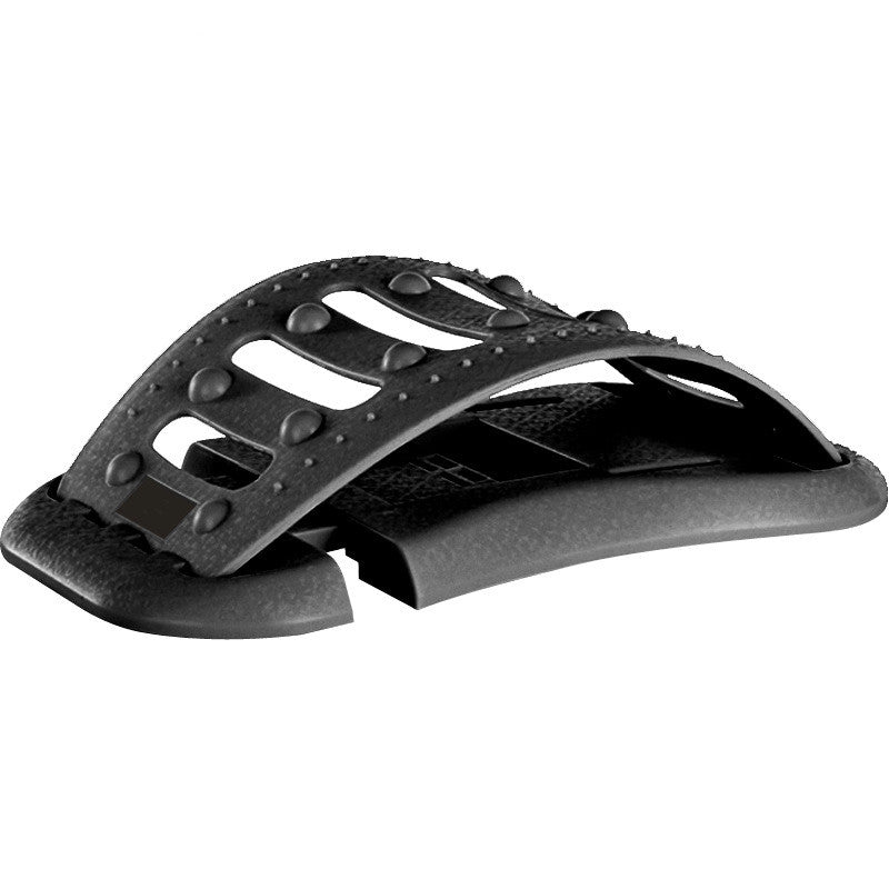 Black lumbar traction brace with raised stud surface and side openings.