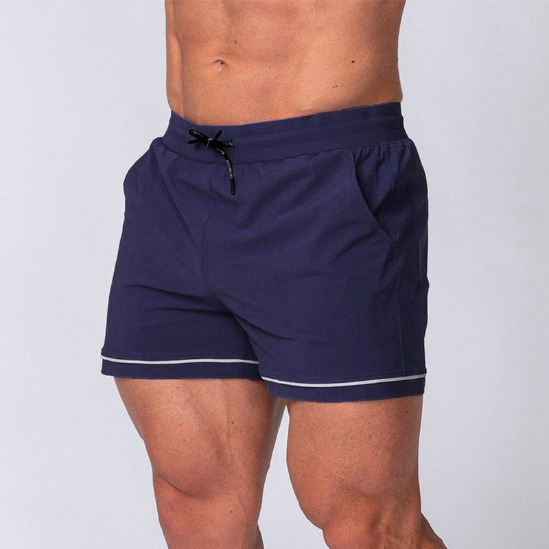 Quick-drying sport running shorts in navy blue, elastic waistband with drawstring and light trim