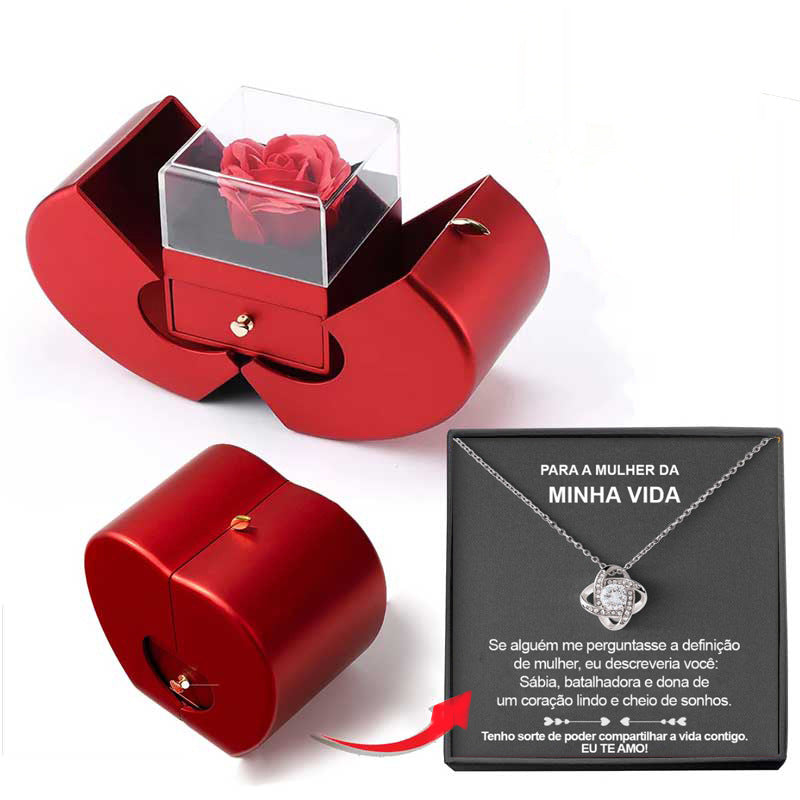 Red jewelry box with clear cover and red rose display; small gift card included
