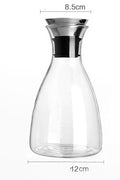 Clear glass water bottle with black neck collar, 12cm wide and 8.5cm top