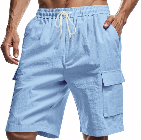 Light blue linen cargo shorts with elastic waistband and drawstring, side flap pockets