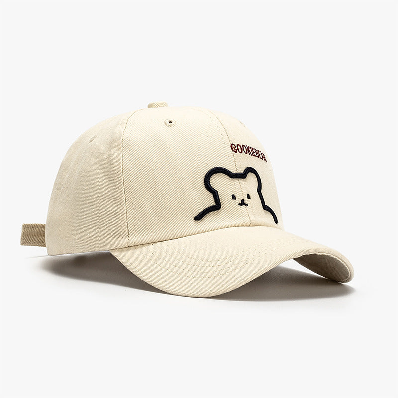 Beige baseball cap with bear outline patch on front panel
