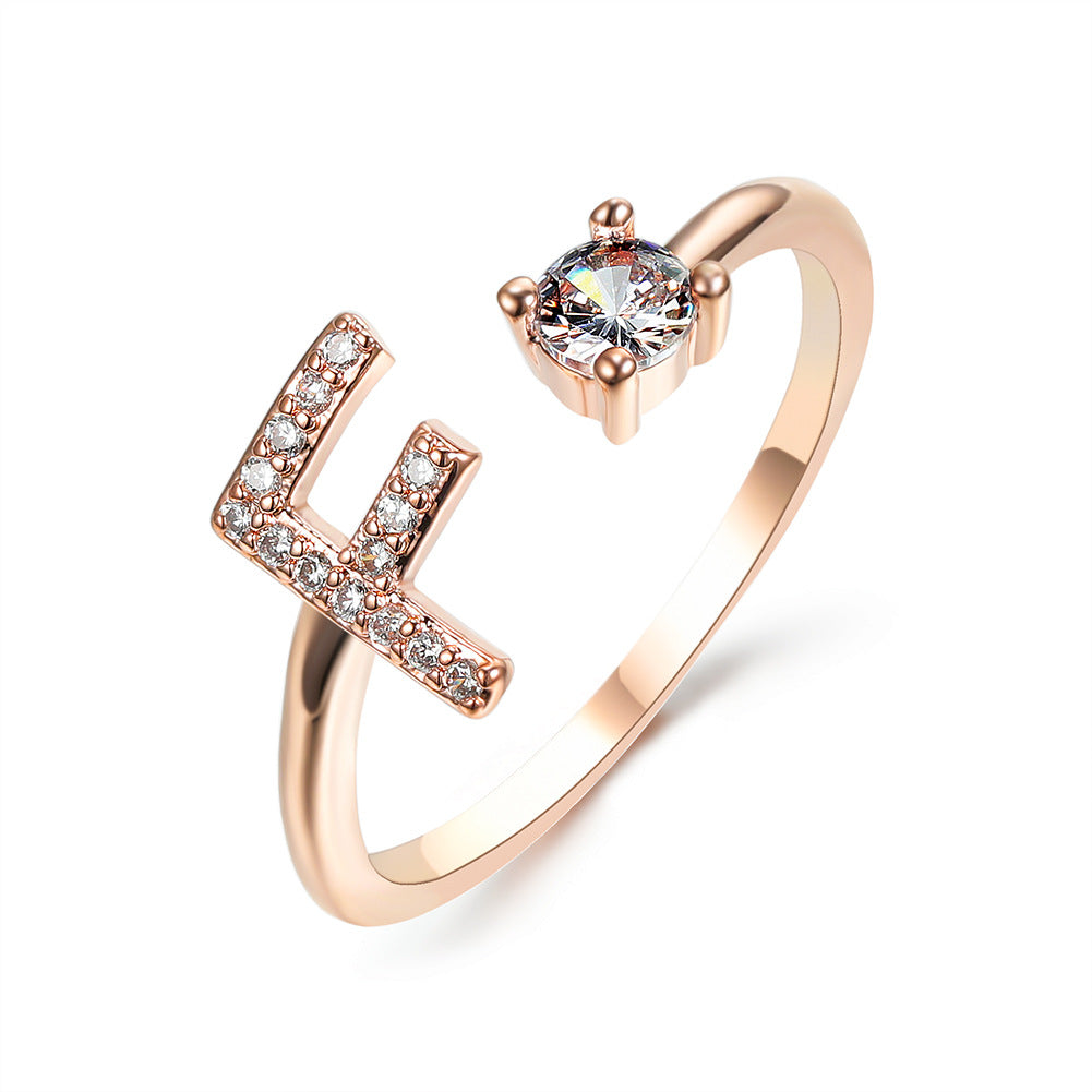 Rose gold initial letter ring with pavé rhinestones and round center crystal