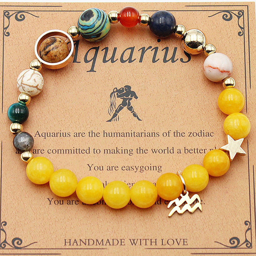 Aquarius zodiac beaded bracelet with yellow beads, multicolor beads, and gold water bearer charm