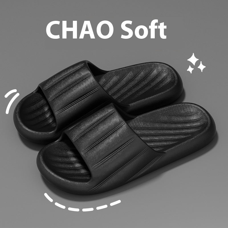 Black striped slip-on home slippers with cushioned thick sole and ridged footbed