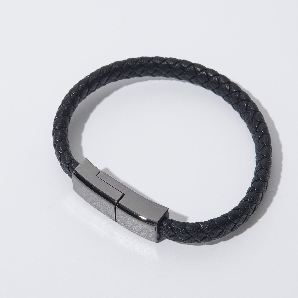 Black braided charging cable bracelet with metal USB plug connector